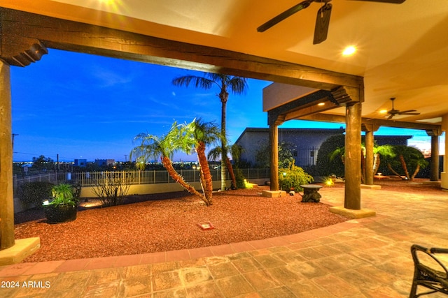 patio terrace at dusk with ceiling fan