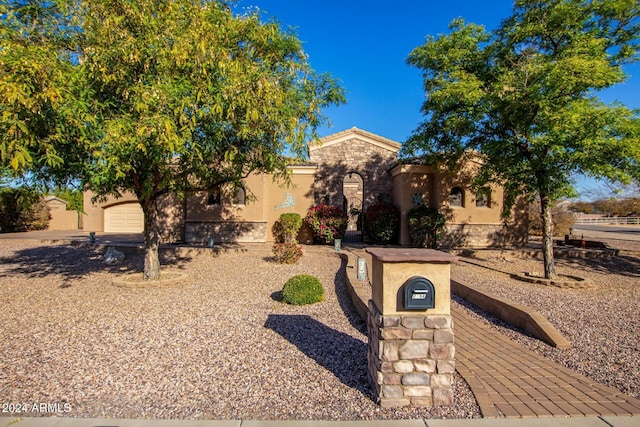 view of front of property with a garage