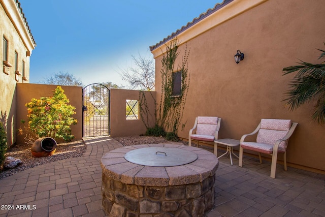 view of patio / terrace featuring an outdoor fire pit