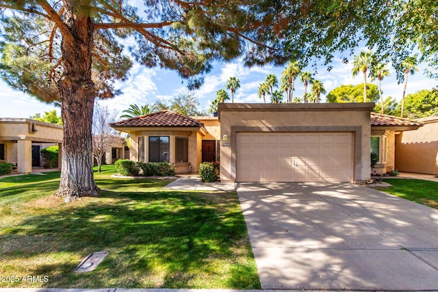 mediterranean / spanish-style house featuring a tile roof, stucco siding, a garage, driveway, and a front lawn