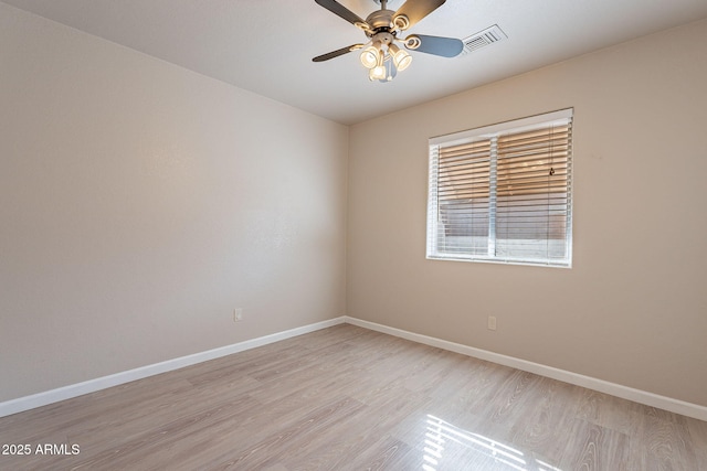 spare room with ceiling fan and light hardwood / wood-style flooring