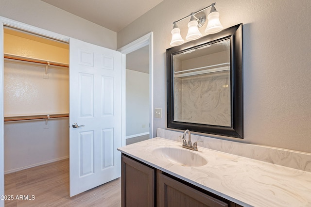 bathroom featuring vanity and hardwood / wood-style flooring