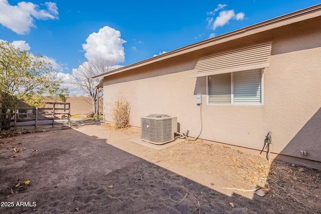 view of side of home with cooling unit