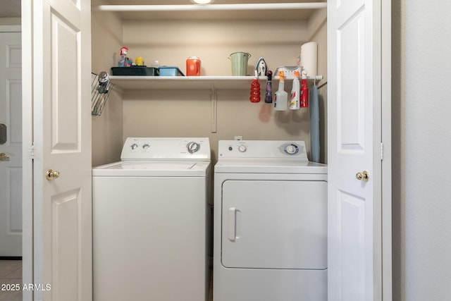 laundry area featuring washing machine and clothes dryer