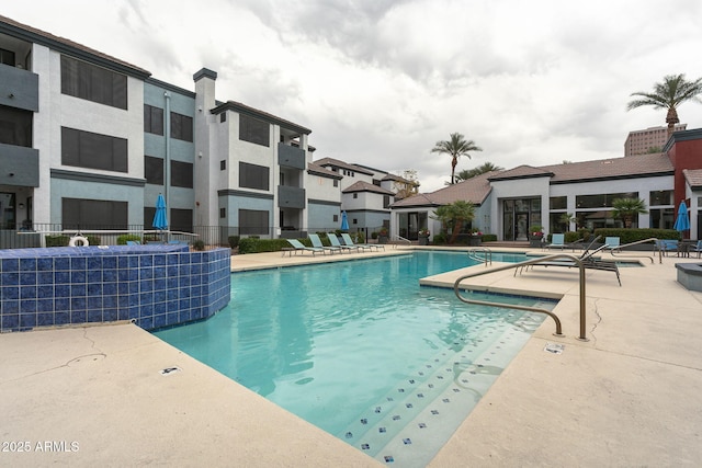 view of swimming pool with a patio area