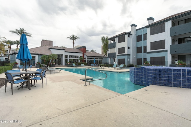 view of swimming pool featuring a patio area