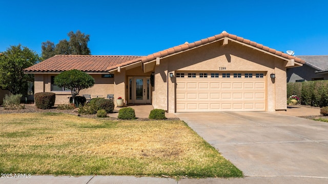 view of front of home featuring stucco siding, a front lawn, concrete driveway, and an attached garage