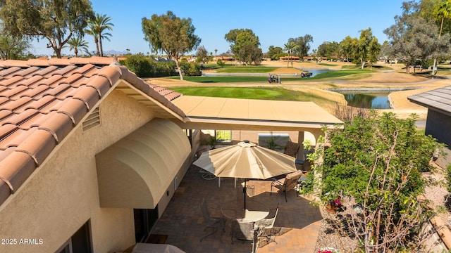 surrounding community featuring golf course view and a water view