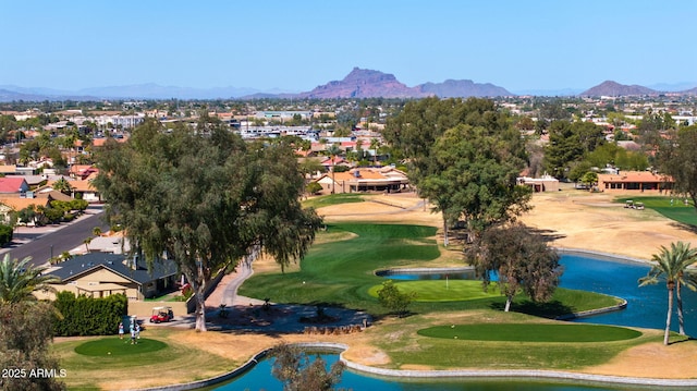 view of community featuring a residential view, a water and mountain view, and view of golf course