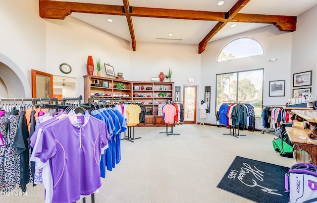 misc room with carpet, baseboards, a high ceiling, recessed lighting, and beamed ceiling