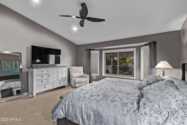 carpeted bedroom featuring lofted ceiling and ceiling fan