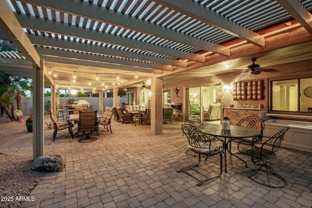 view of patio with outdoor dining area, fence, an outdoor living space, and ceiling fan