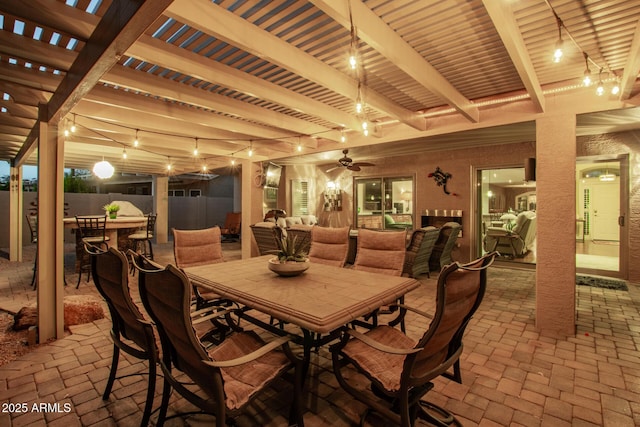 view of patio featuring fence, outdoor dining area, and a pergola