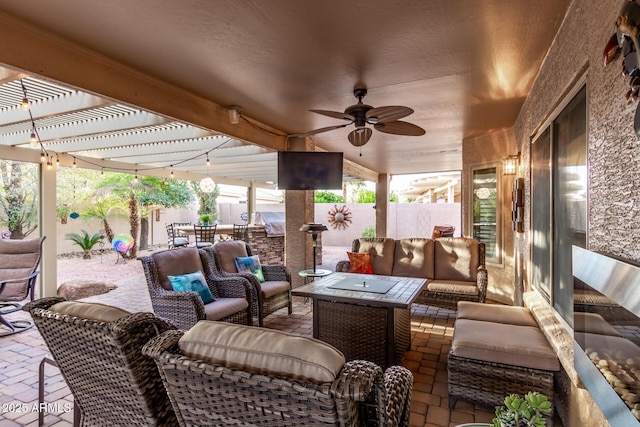 view of patio / terrace with a ceiling fan, fence, an outdoor living space, and a pergola