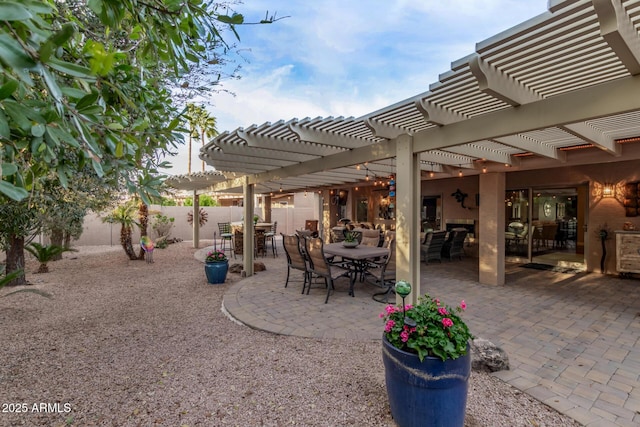 view of patio with outdoor dining space and a fenced backyard