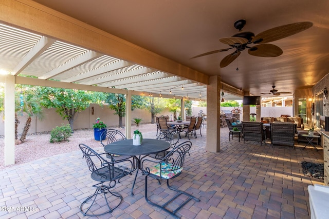 view of patio / terrace featuring a fenced backyard, a ceiling fan, outdoor dining area, and a pergola