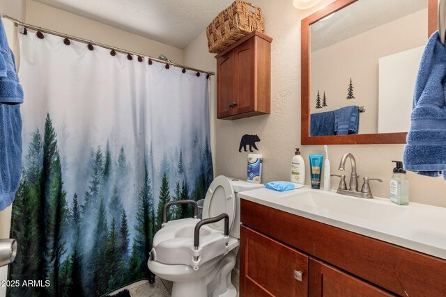 3971 N Apache Trl, Pine, AZ 85544 - bathroom with toilet, vanity, a shower with shower curtain, and a textured wall