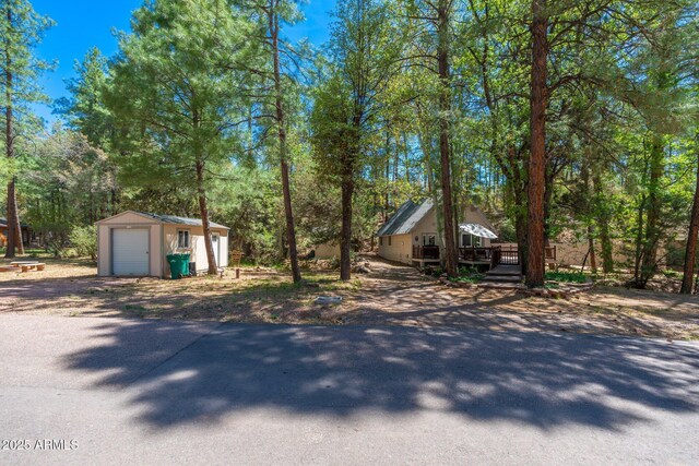 3971 N Apache Trl, Pine, AZ 85544 - view of front of property featuring a garage, an outdoor structure, and a deck