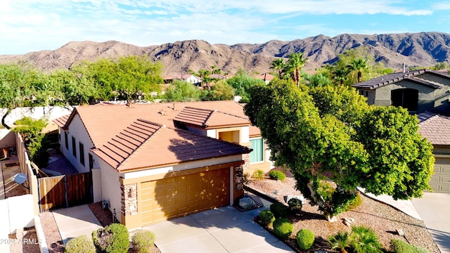 view of front of home featuring a mountain view and a garage