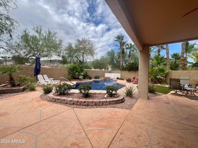 view of patio featuring a fenced in pool