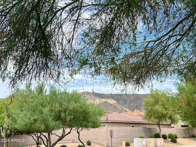 view of side of property with a mountain view