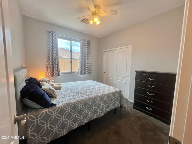 carpeted bedroom featuring a closet and ceiling fan