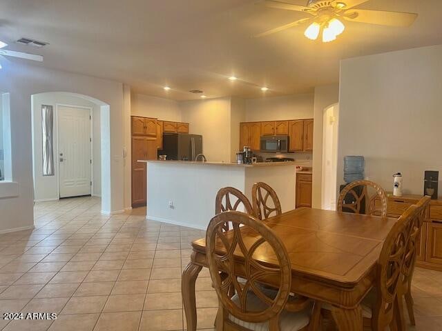 dining room featuring ceiling fan and light tile patterned floors