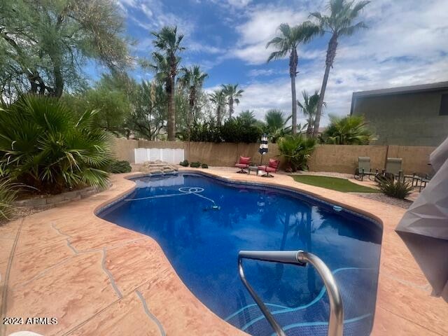 view of swimming pool featuring a patio