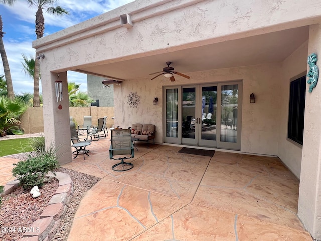 view of patio featuring ceiling fan and french doors