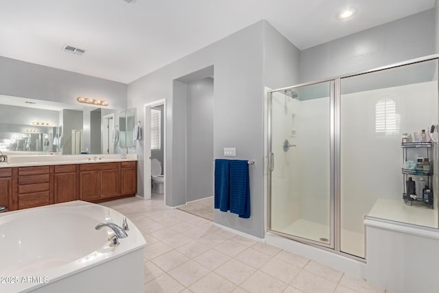 full bathroom with vanity, toilet, independent shower and bath, and tile patterned flooring