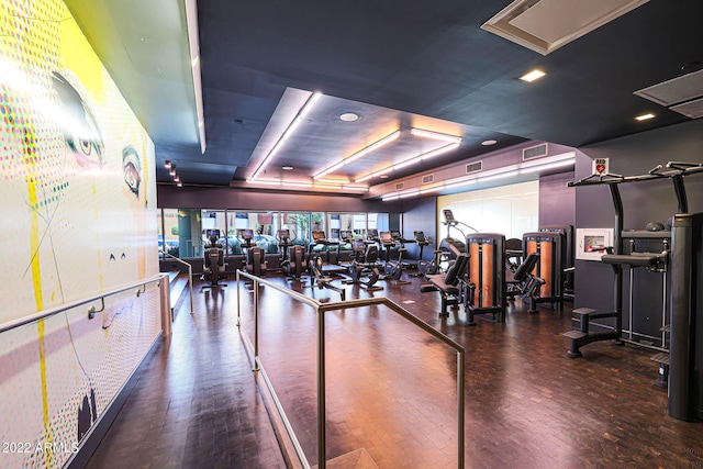 workout area with dark hardwood / wood-style floors