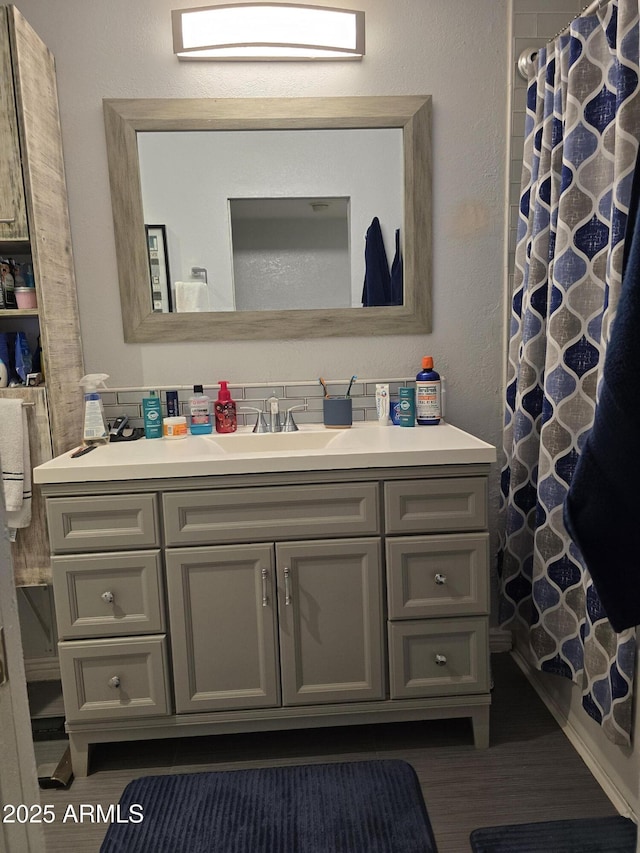 full bathroom with vanity and a shower with shower curtain