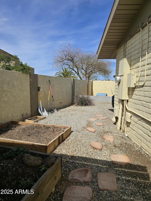 view of yard with a fenced backyard