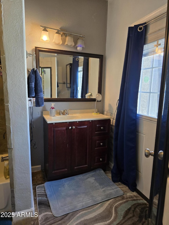 bathroom featuring a bathtub and vanity