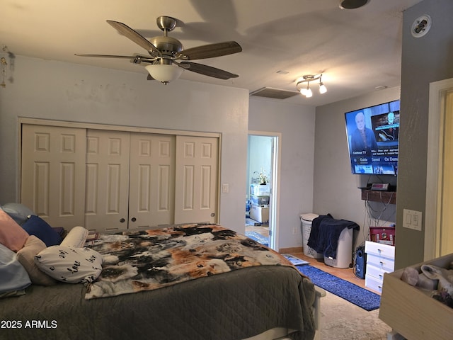 bedroom with visible vents, a closet, and ceiling fan