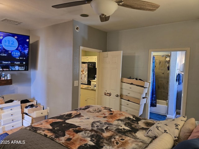 bedroom featuring visible vents, ensuite bath, black refrigerator, and ceiling fan