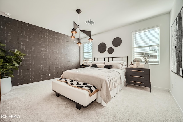 bedroom featuring light carpet