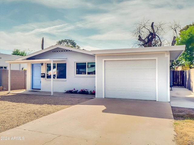 single story home featuring a garage