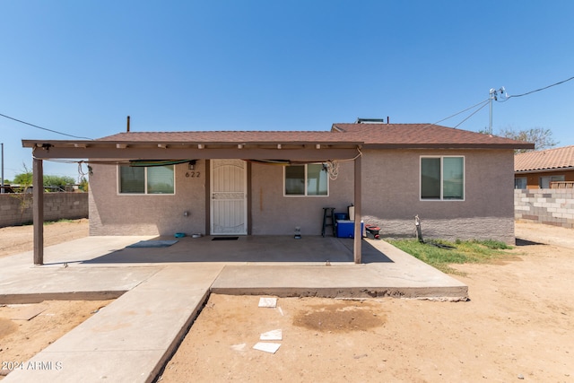 rear view of property featuring a patio