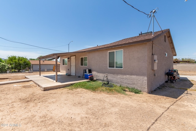 back of house featuring a patio area