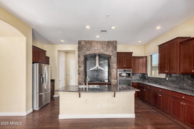 26796 N 86th Ln, Peoria, AZ 85383 - kitchen featuring decorative backsplash, visible vents, dark wood finished floors, appliances with stainless steel finishes, and a sink