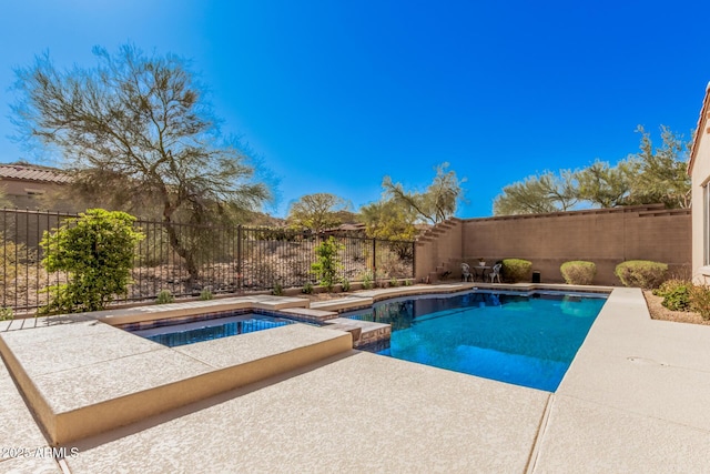 26796 N 86th Ln, Peoria, AZ 85383 - view of swimming pool featuring a fenced backyard, a pool with connected hot tub, and a patio