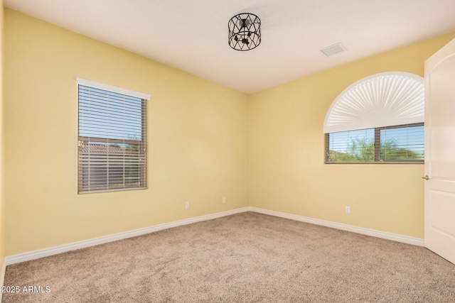 26796 N 86th Ln, Peoria, AZ 85383 - spare room featuring baseboards, visible vents, and carpet flooring