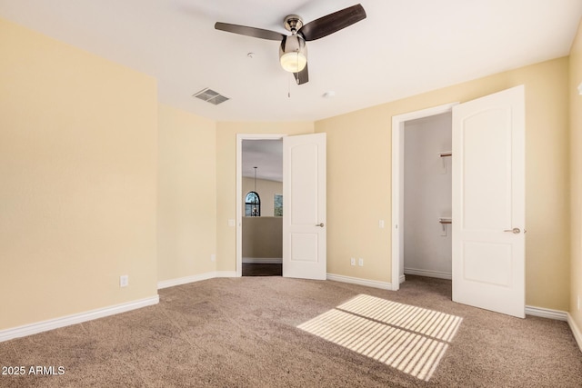 26796 N 86th Ln, Peoria, AZ 85383 - unfurnished bedroom featuring carpet flooring, a ceiling fan, baseboards, and visible vents