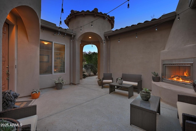 26796 N 86th Ln, Peoria, AZ 85383 - view of patio featuring an outdoor living space with a fireplace
