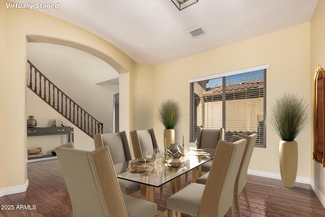 26796 N 86th Ln, Peoria, AZ 85383 - dining area with hardwood / wood-style floors, baseboards, stairway, and visible vents