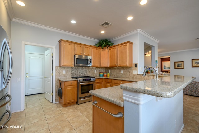 kitchen featuring appliances with stainless steel finishes, crown molding, and backsplash