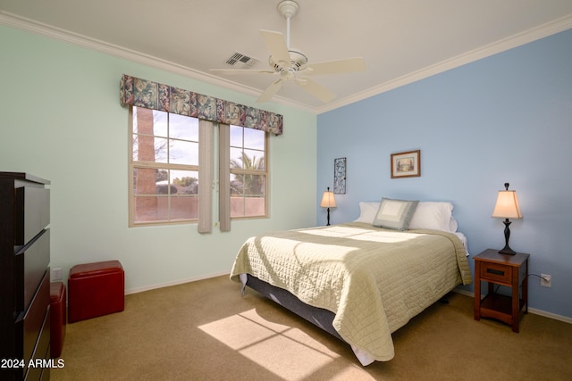 carpeted bedroom featuring ceiling fan and ornamental molding