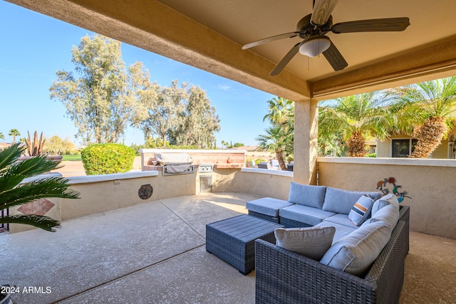 view of patio / terrace featuring ceiling fan, outdoor lounge area, a grill, and an outdoor kitchen