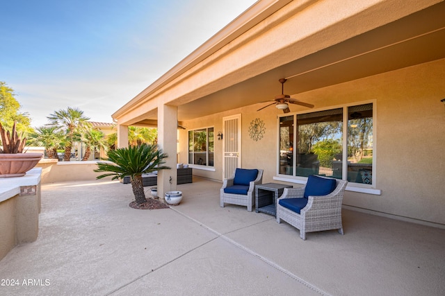 view of patio featuring ceiling fan